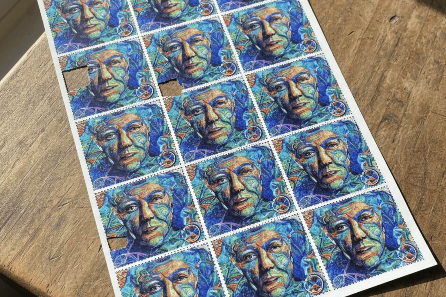 Sheet of colorful blotter art featuring Albert Hofmann, representing the legal status of LSD and 1S-LSD research chemicals in Germany.